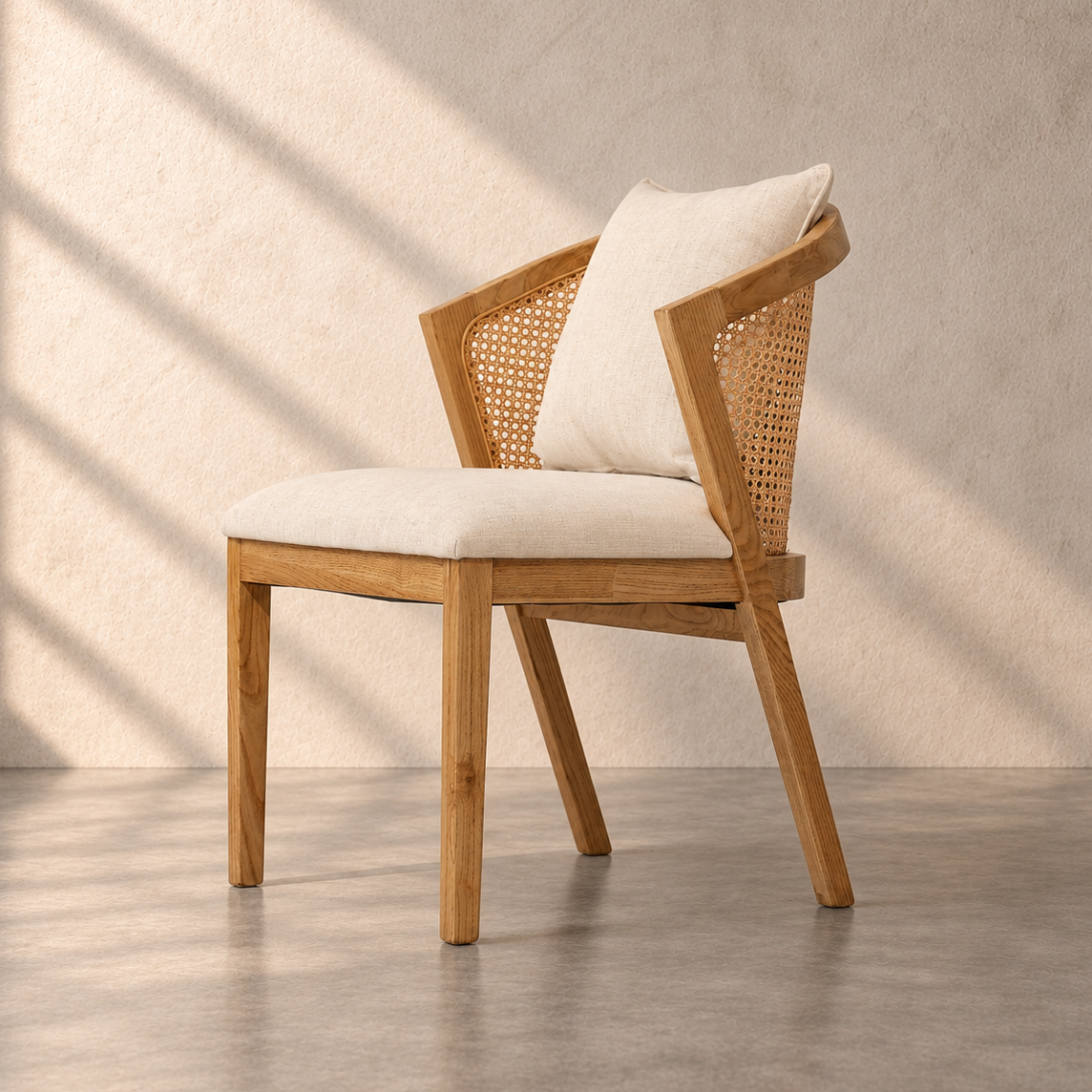 Florence Chair in solid oak wood with natural cane backrest, curved armrests and beige upholstered seat – The Attic Dubai.
