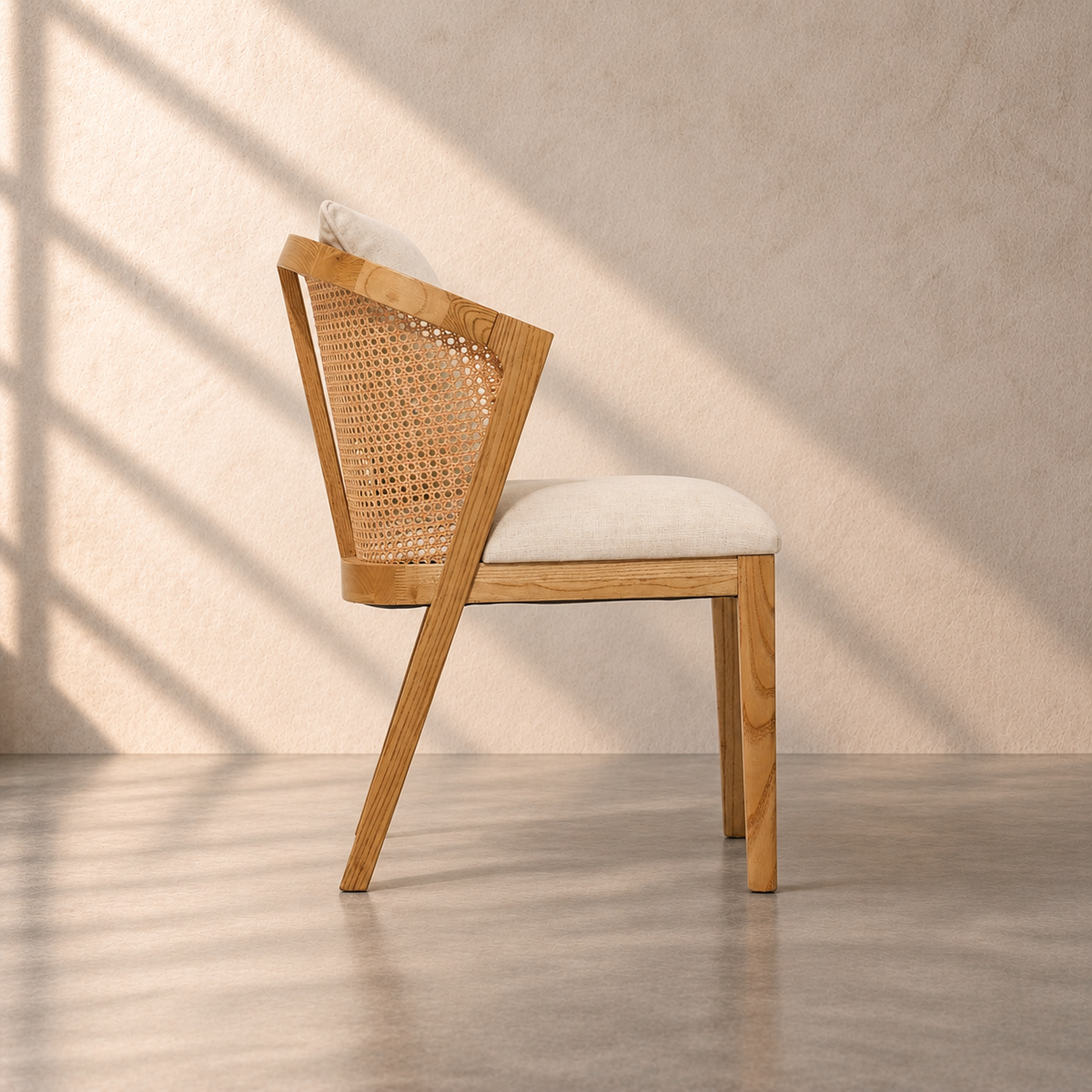 Florence Chair in solid oak wood with natural cane backrest, curved armrests and beige upholstered seat – The Attic Dubai.