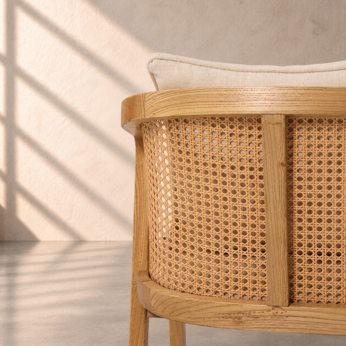 Florence Chair in solid oak wood with natural cane backrest, curved armrests and beige upholstered seat – The Attic Dubai.